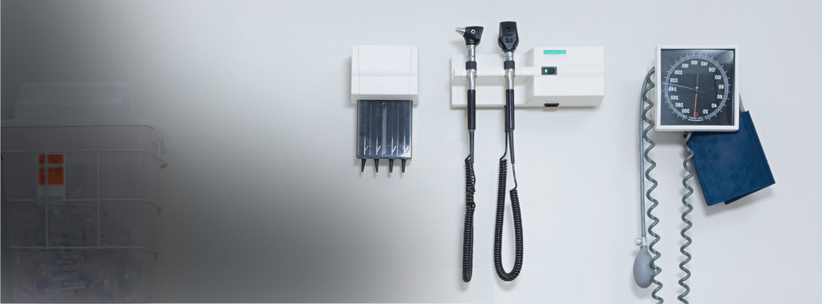 Doctor office wall with hanging medical tools.