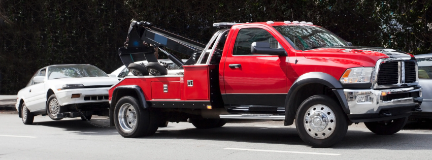 Tow truck towing a card.