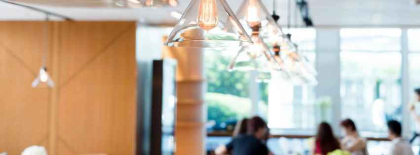 Lights hanging from a ceiling over a countertop.